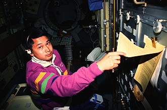Trinh onboard Space Shuttle