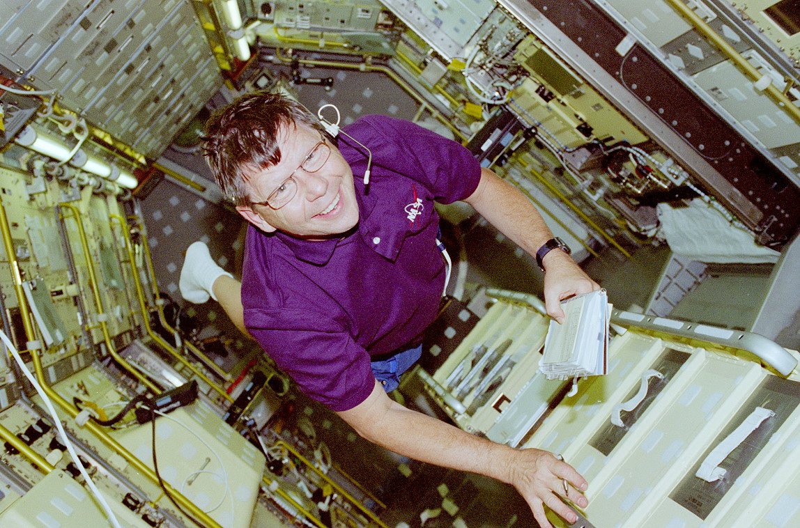 Crouch onboard Space Shuttle